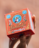 Hand holding a box of Fishwife's Smoked Salmon