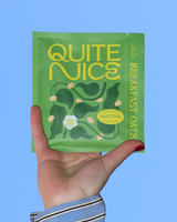 Hand holding Quite Nice - Matcha & Vanilla Prebiotic Oatmeal