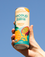 Hand holding Recoup- Pineapple Passionfruit