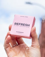 Hand holding Refresh - Raspberry Gum