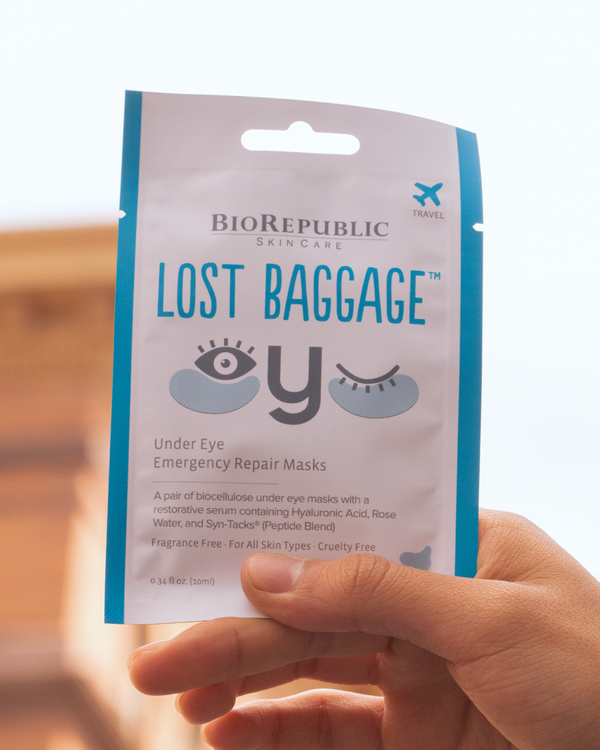 BioRepublic Lost Baggage under eye emergency repair masks packaging held by a hand.