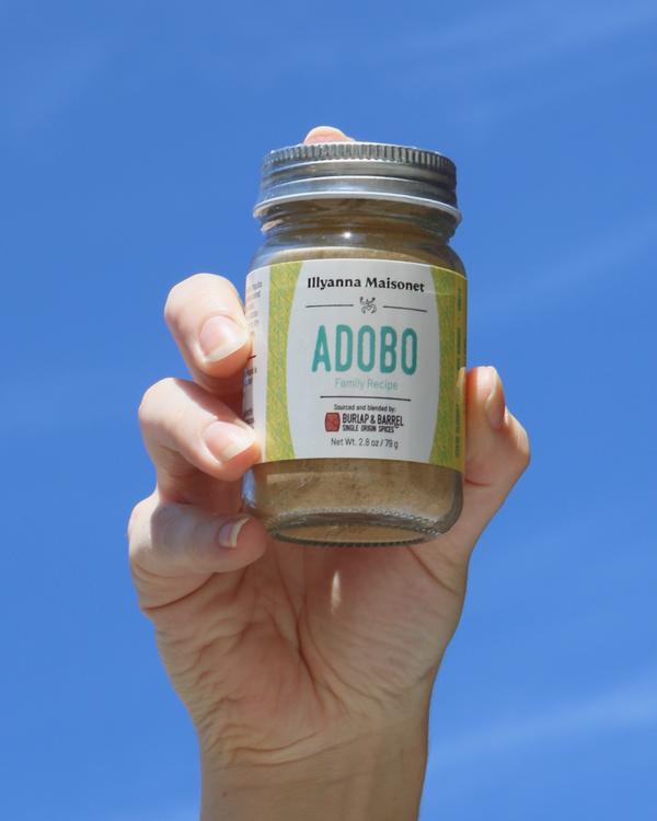 Hand holding Burlap_Barrel_Adobo in the air
