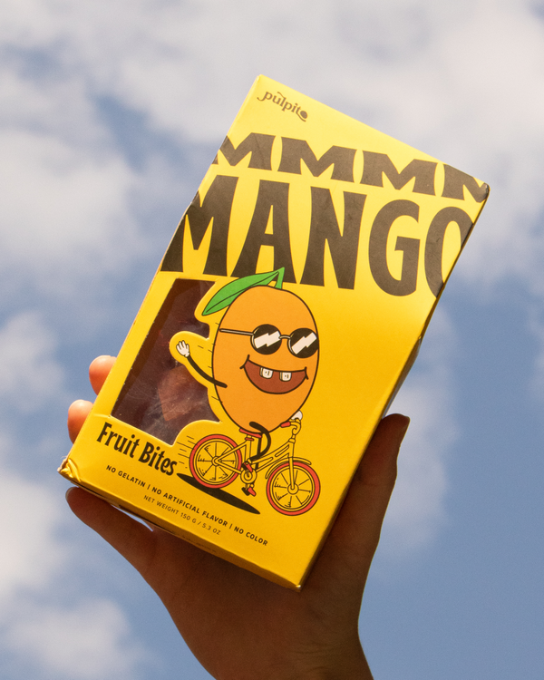 Hand holding Pulpito - MMMM Mango Fruit Bites